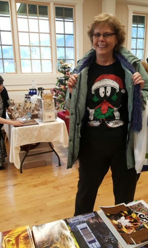 Attendee sporting her Marvin the Martian Santa shirt